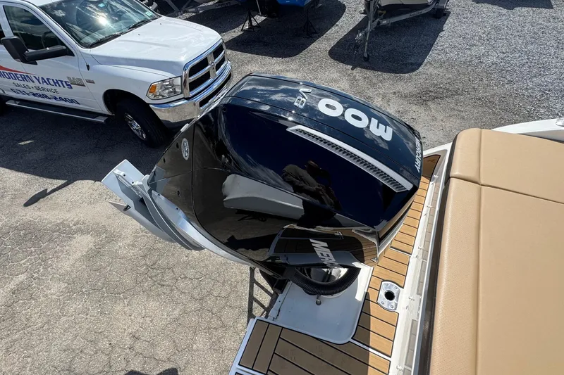 Slide: The Image of 2026 Sea Ray SDX 250 Outboard with Mercury engine, parked near service truck. - 9