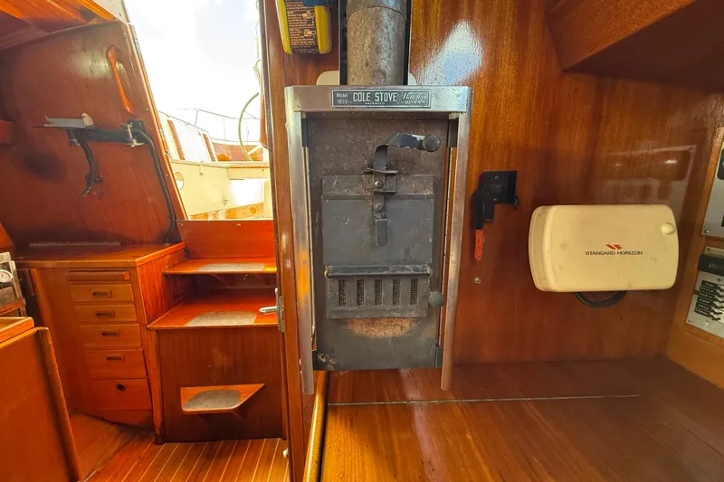 Slide: The Image of Wooden interior of 1986 Vindo 45 sailboat with stove and navigation equipment. - 15