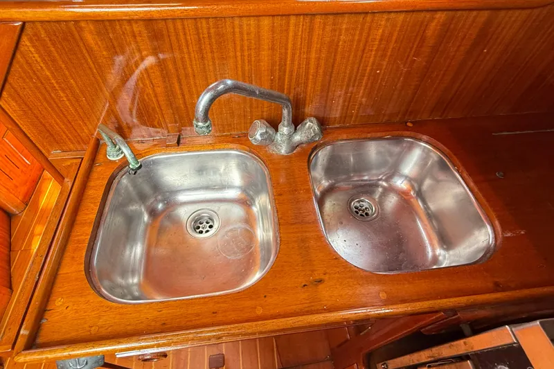 Slide: The Image of Dual stainless steel sinks in 1986 Vindo 45 yacht kitchen, wooden countertop. - 29