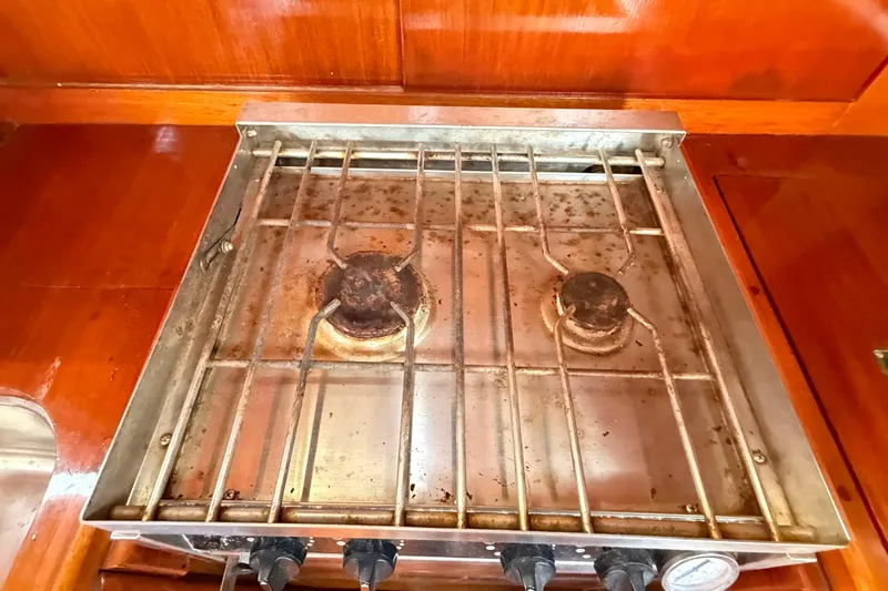 Slide: The Image of Two-burner stove on a 1986 Vindo 45 yacht, featuring a stainless steel surface. - 31