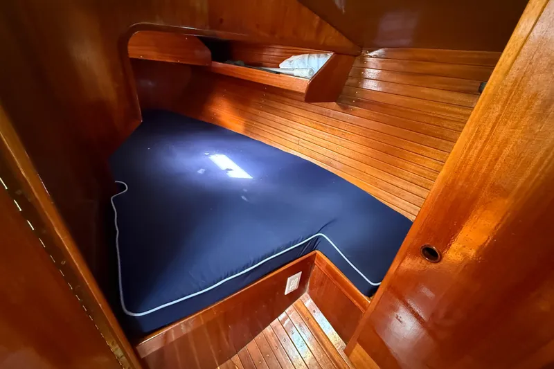 Slide: The Image of Cozy wooden cabin interior of 1986 Vindo 45 sailboat with blue mattress. - 35