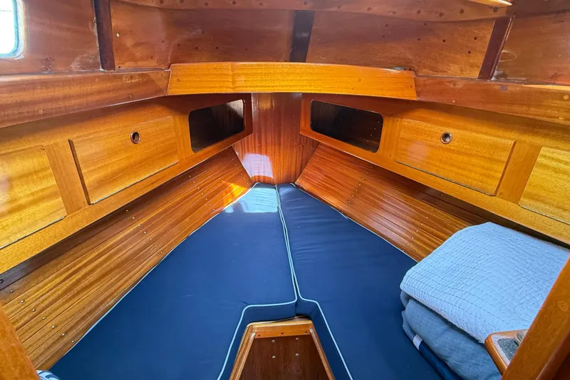 Slide: The Image of Cozy wooden cabin interior of 1986 Vindo 45 sailboat with blue cushions. - 37