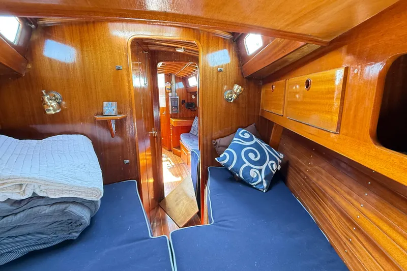 Slide: The Image of Cozy cabin interior of 1986 Vindo 45 sailboat with wooden finish and nautical decor. - 41