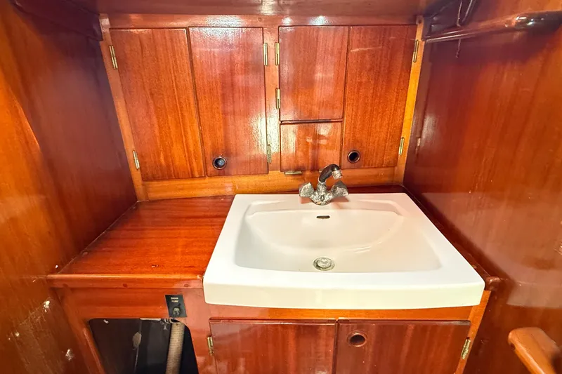 Slide: The Image of Wooden interior of 1986 Vindo 45 yacht with sink and cabinets. - 43