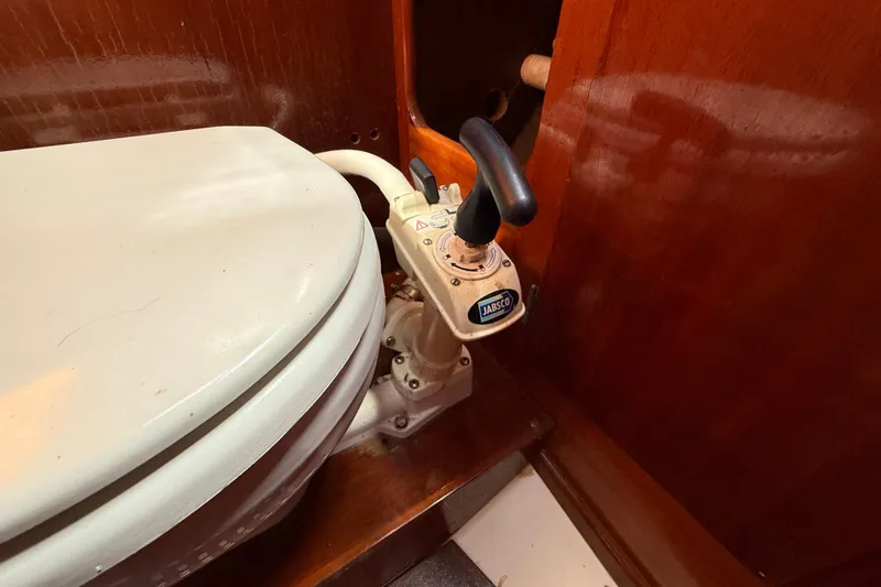 Slide: The Image of Manual marine toilet with Jabsco pump handle in a Vindo 45 yacht, 1986 model. - 45