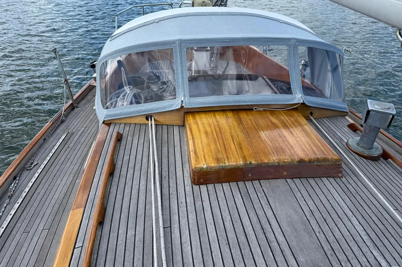 Slide: The Image of 1986 Vindo 45 sailboat deck with wooden finish and protective canopy. - 55