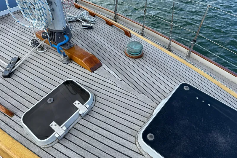 Slide: The Image of Deck of 1986 Vindo 45 sailboat with wooden finish and nautical equipment. - 57