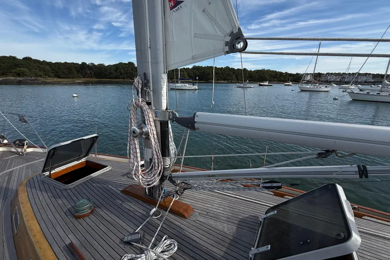 Slide: The Image of Sailboat deck view of 1986 Vindo 45, moored in a scenic harbor. - 67