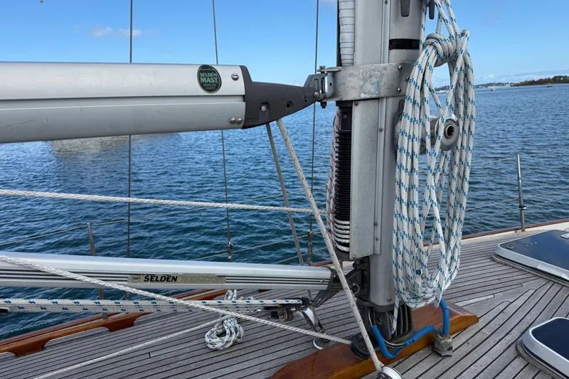 Slide: The Image of Sailboat deck with rigging and mast, Vindo 45, 1986 model, on calm water. - 68