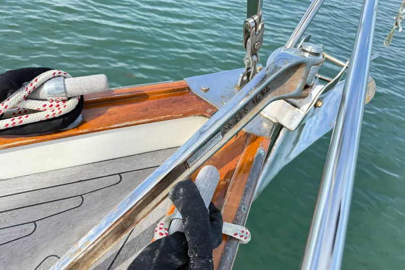 Slide: The Image of Bow of 1986 Vindo 45 sailboat with anchor and ropes on deck. - 69