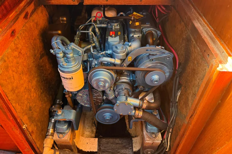 Slide: The Image of Engine compartment of a 1986 Vindo 45 sailboat, showcasing detailed mechanical components. - 72