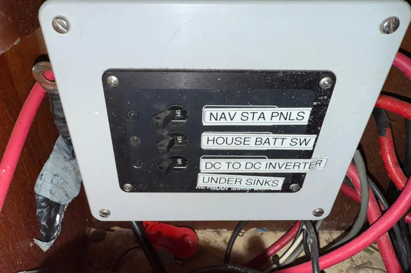 Slide: The Image of Electrical panel with labeled switches on a 1986 Vindo 45 boat. - 75