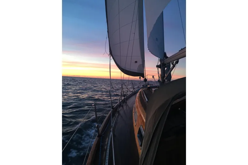 Slide: The Image of Sailing Vindo 45 yacht at sunset, 1986 model, on open sea. - 82
