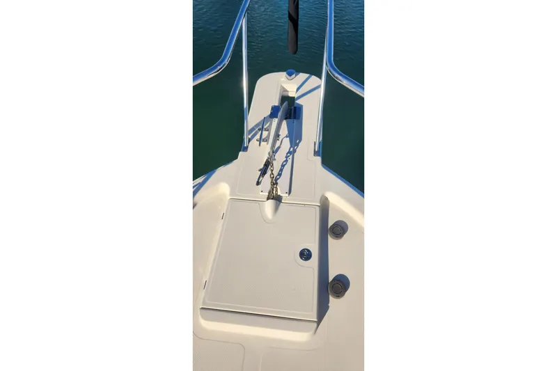 Slide: The Image of Bow of 2003 Mainship Pilot 30-II with anchor chain and railing. - 28