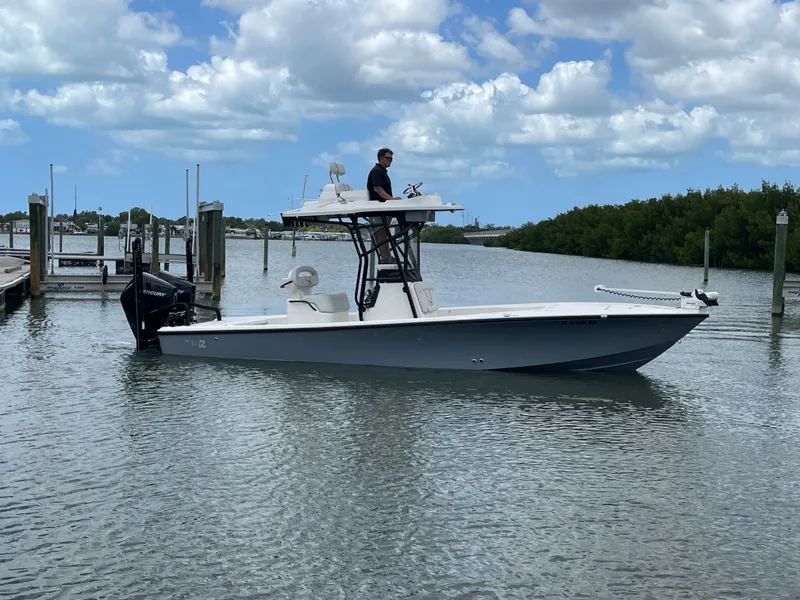 Slide: The Image of 2023 SeaVee 270 Z boat on calm water with blue sky. - 10