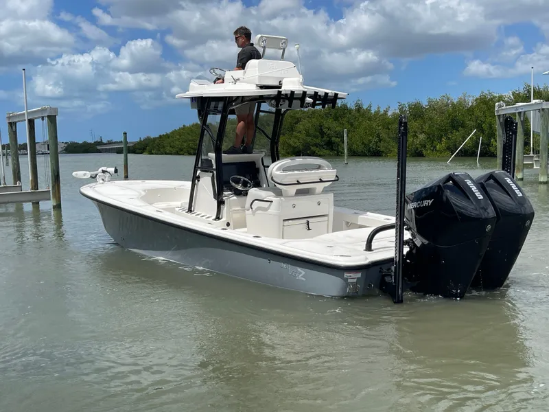 Slide: The Image of 2023 SeaVee 270 Z boat on calm water with dual Mercury engines. - 12