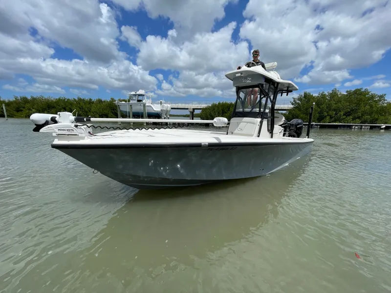 Slide: The Image of 2023 SeaVee 270 Z boat on calm water with blue sky. - 19