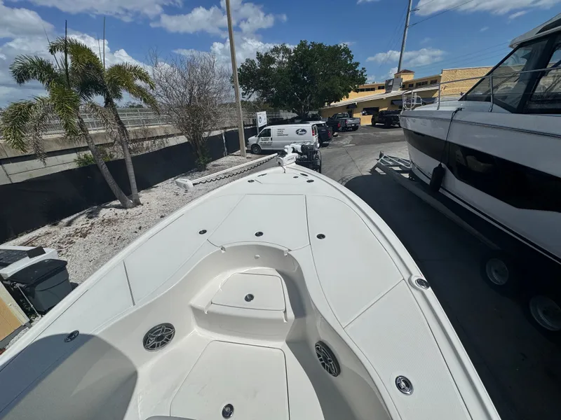 Slide: The Image of SeaVee 270 Z boat 2023 on a parking lot under sunny weather. - 25