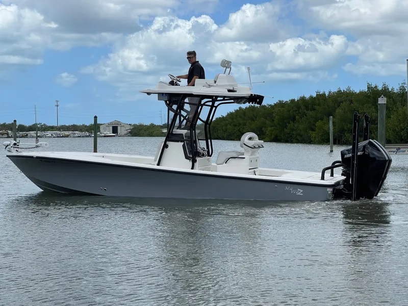 Slide: The Image of 2023 SeaVee 270 Z boat on calm water with blue sky. - 3