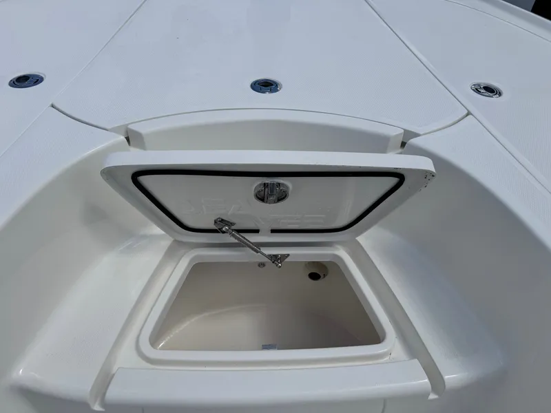 Slide: The Image of Open storage compartment on a 2023 SeaVee 270 Z boat. - 38