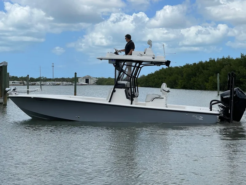 Slide: The Image of 2023 SeaVee 270 Z boat on calm water with blue sky. - 4