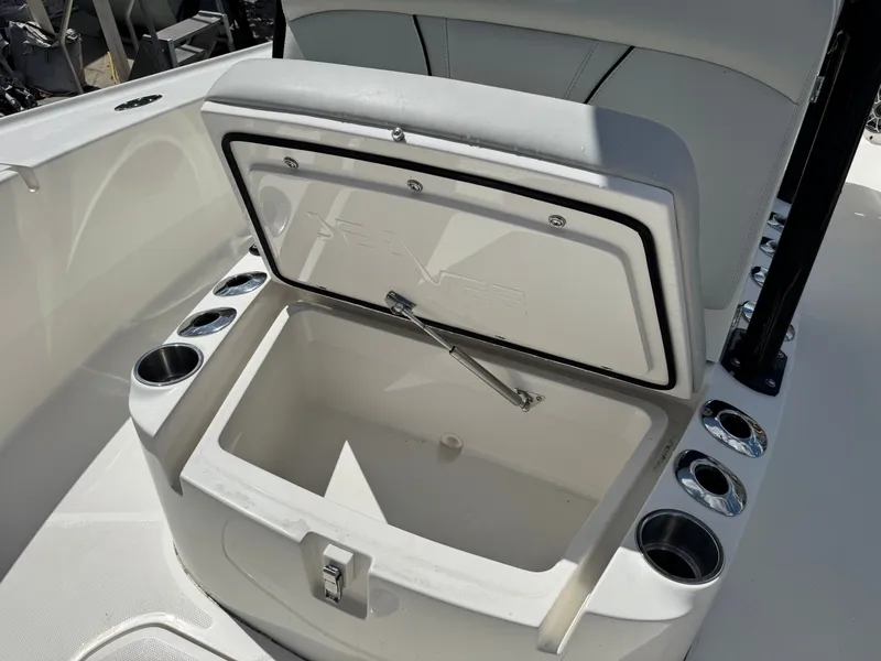 Slide: The Image of SeaVee 270 Z 2023 boat with open storage compartment and cup holders. - 41