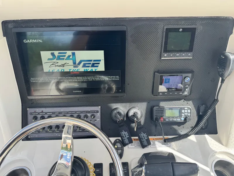 Slide: The Image of Dashboard of SeaVee 270 Z boat featuring Garmin system. - 48