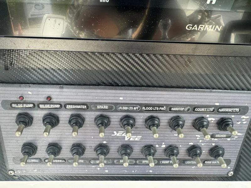Slide: The Image of SeaVee 270 Z control panel with toggle switches, 2023 model. - 49