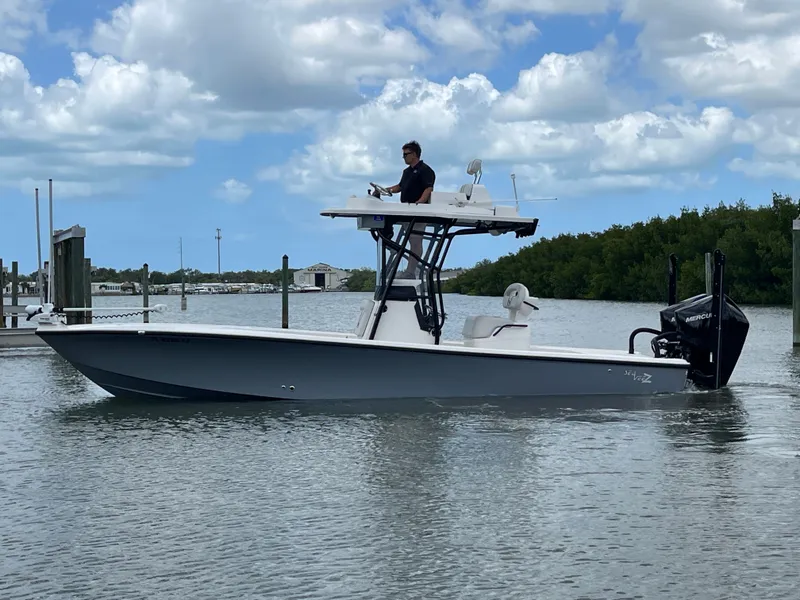 Slide: The Image of 2023 SeaVee 270 Z boat on calm water under blue sky. - 6