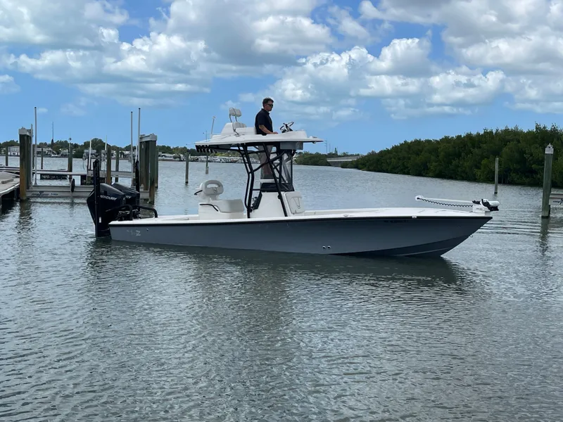 Slide: The Image of 2023 SeaVee 270 Z boat on calm water with blue sky. - 8