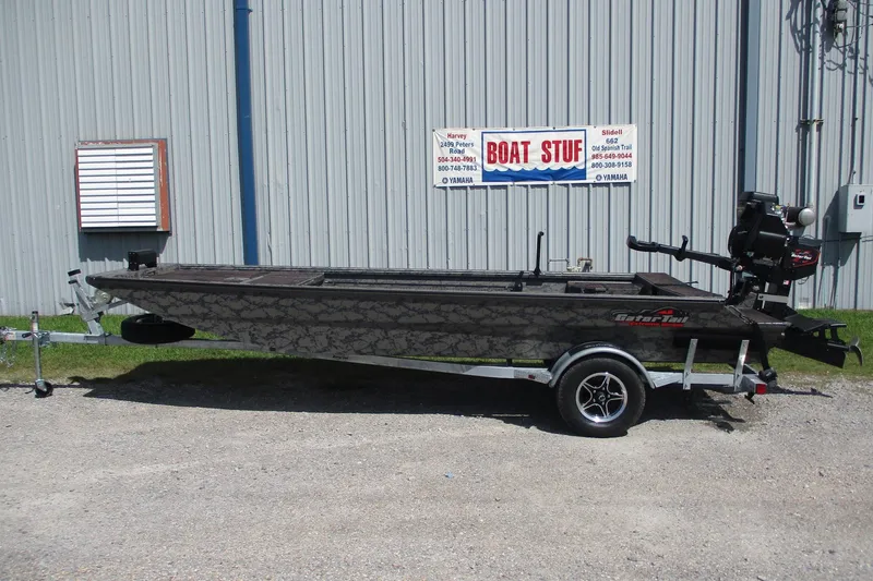 The Image of 2026 Gator Tail 1860 Extreme boat on trailer outside a metal building. - 0