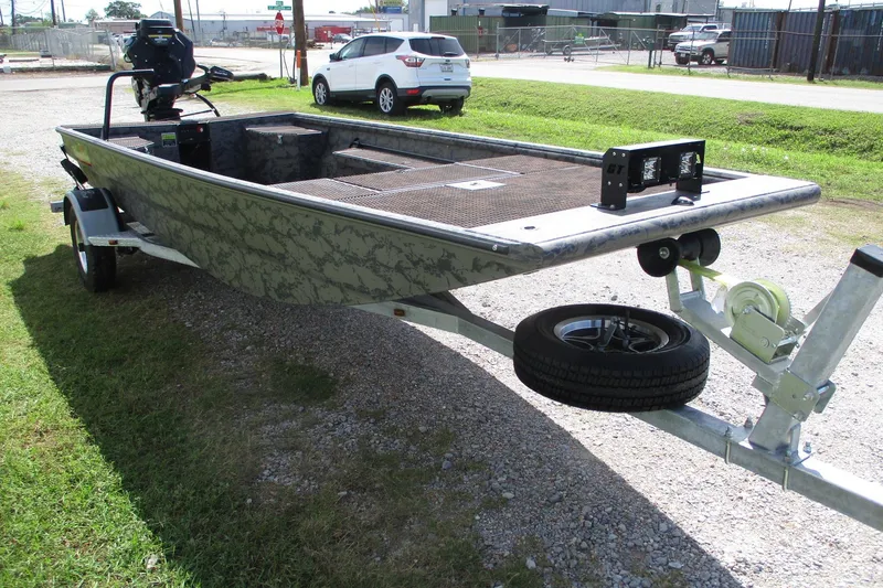 Slide: The Image of 2026 Gator Tail 1860 Extreme boat on trailer, parked outdoors. - 2