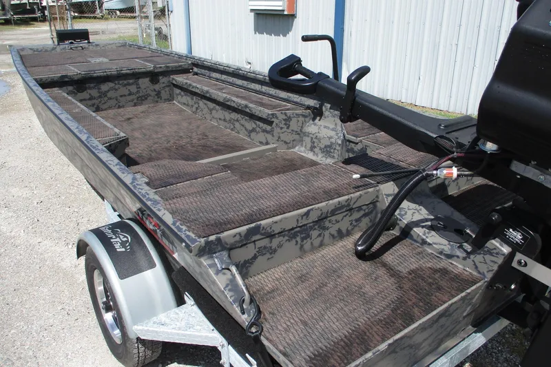 Slide: The Image of 2026 Gator Tail 1860 Extreme boat with camo design on a trailer. - 3