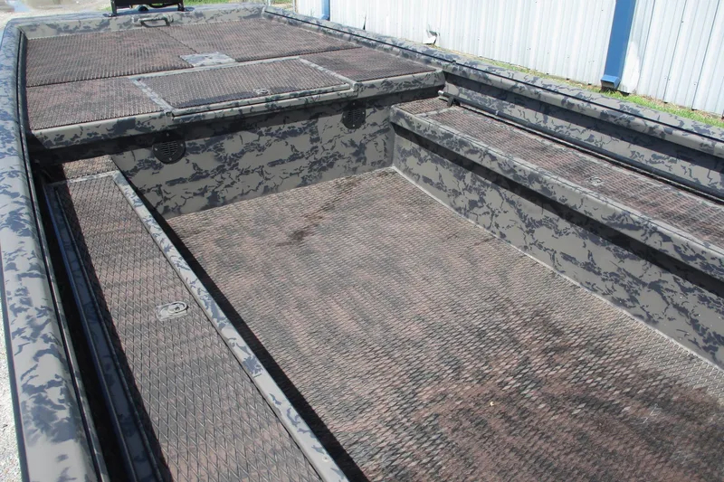 Slide: The Image of 2026 Gator Tail 1860 Extreme boat interior with camouflage pattern and textured flooring. - 5