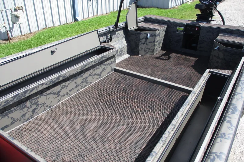 Slide: The Image of 2026 Gator Tail 1860 Extreme boat interior with storage compartments and camouflage design. - 8