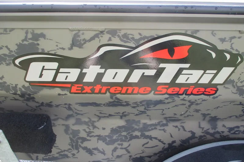 Slide: The Image of Gator Tail 1860 Extreme Series logo on camouflage background, 2026 model. - 9