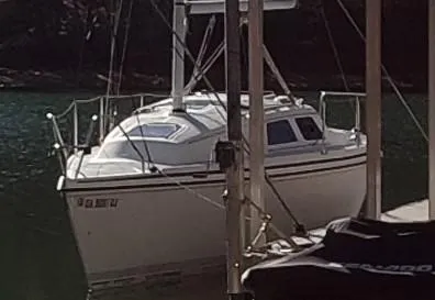 Slide: The Image of 1992 Hunter 27 sailboat docked in harbor. - 1