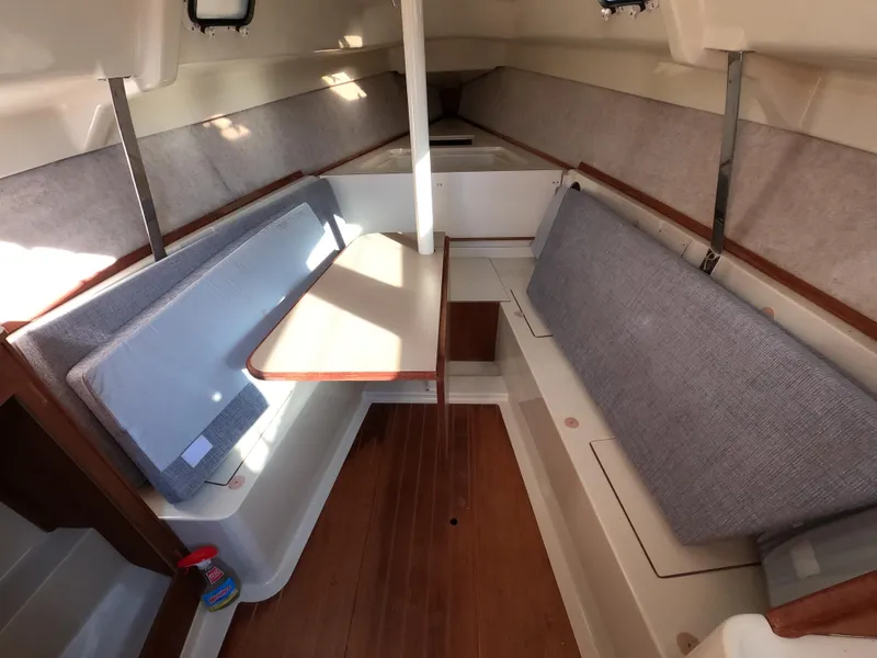 Slide: The Image of Interior of a 1992 Hunter 27 sailboat with seating area. - 10