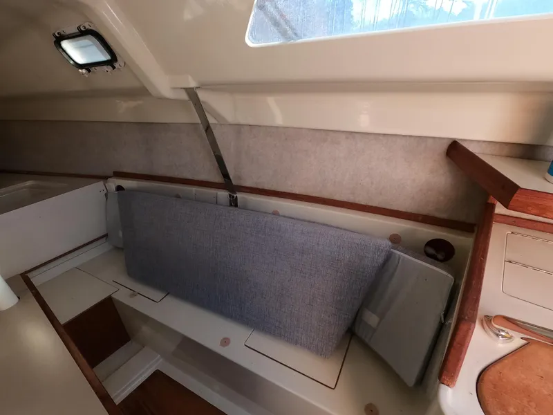 Slide: The Image of Interior of a 1992 Hunter 27 sailboat with seating area. - 12
