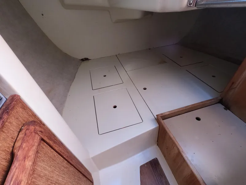 Slide: The Image of Interior of a 1992 Hunter 27 sailboat with storage compartments. - 15