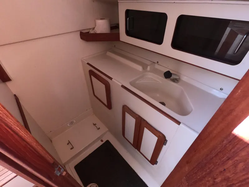 Slide: The Image of Interior of a 1992 Hunter 27 yacht with sink and storage. - 18
