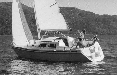 Slide: The Image of 1992 Hunter 27 sailboat cruising on a serene lake. - 23