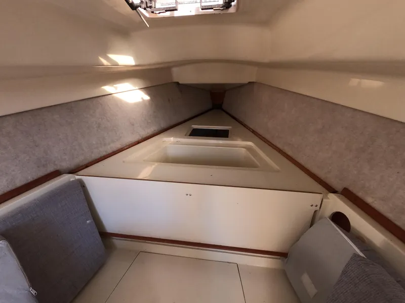 Slide: The Image of Interior of a 1992 Hunter 27 yacht with cozy seating. - 9