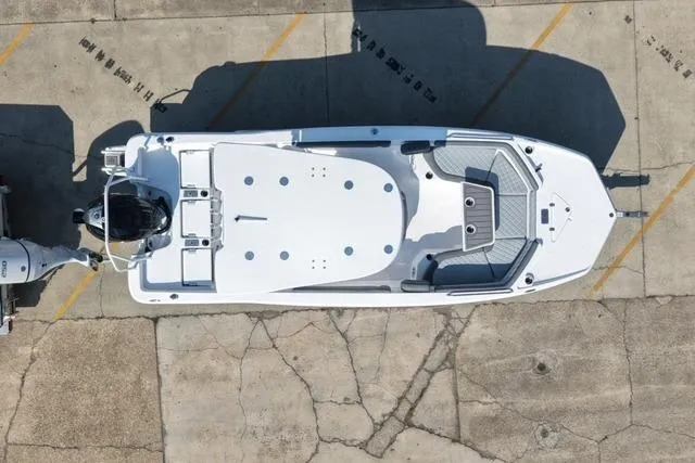Slide: The Image of Overhead view of 2026 NauticStar 231 Hybrid boat on concrete surface. - 7