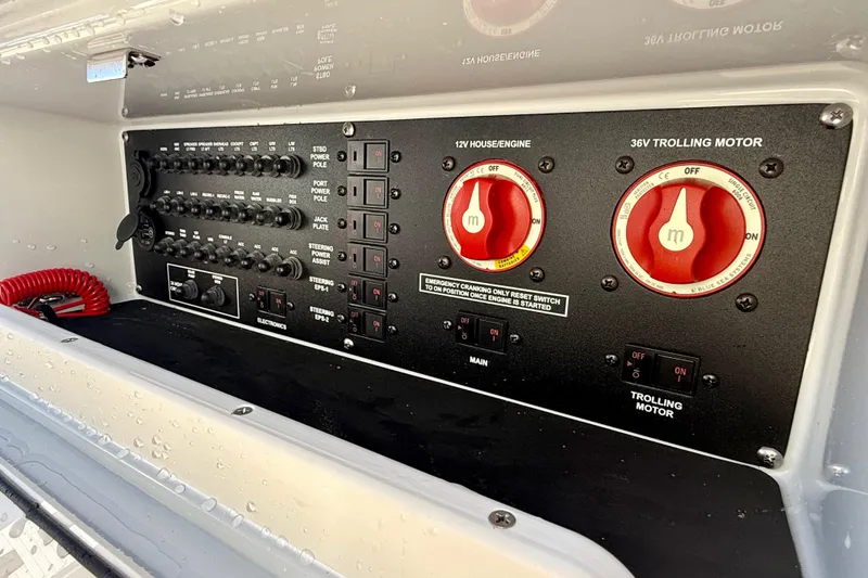 Slide: The Image of Control panel of 2025 Pathfinder 2300 HPS boat with switches and dials. - 15