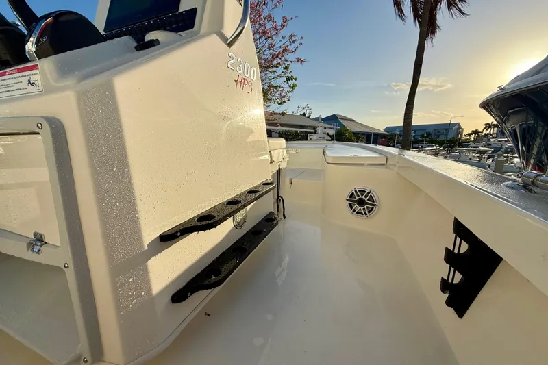 Slide: The Image of 2025 Pathfinder 2300 HPS boat interior with sleek design and modern features at sunset. - 16