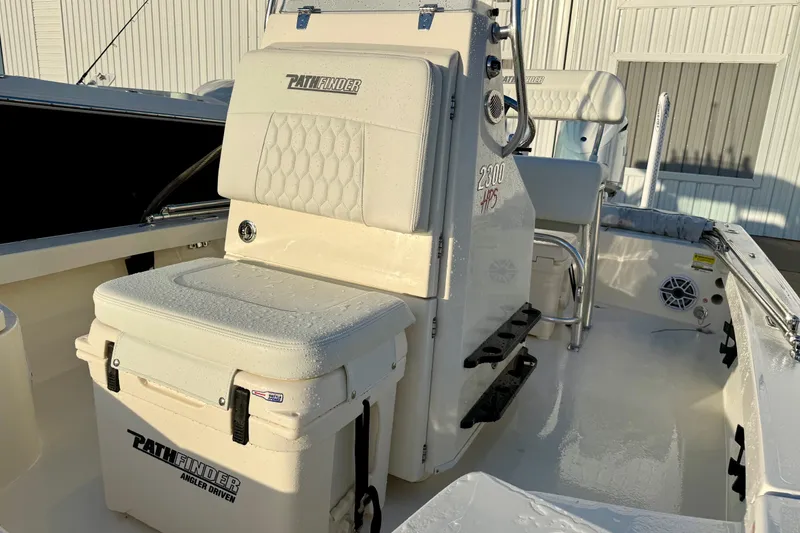 Slide: The Image of 2025 Pathfinder 2300 HPS boat interior with seating and storage compartments. - 17