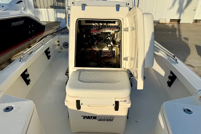 Slide: The Image of 2025 Pathfinder 2300 HPS boat interior with open storage compartment and visible wiring. - 21
