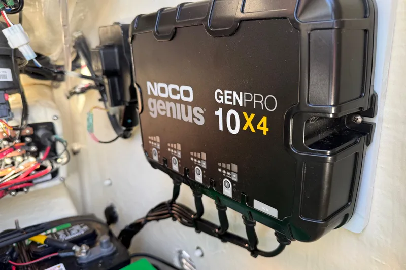 Slide: The Image of NOCO Genius GENPRO 10X4 charger installed in 2025 Pathfinder 2300 HPS boat. - 23
