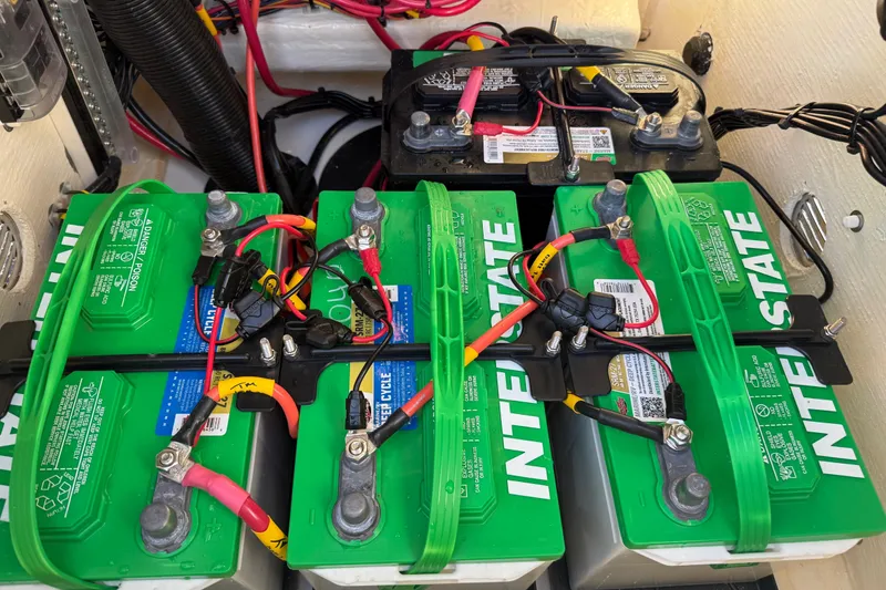 Slide: The Image of Battery setup in a 2025 Pathfinder 2300 HPS boat, featuring Interstate batteries. - 25